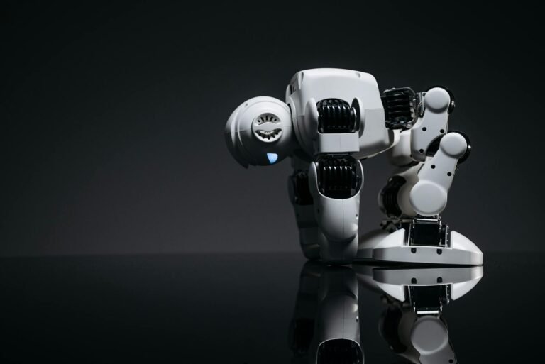 white robot on black surface